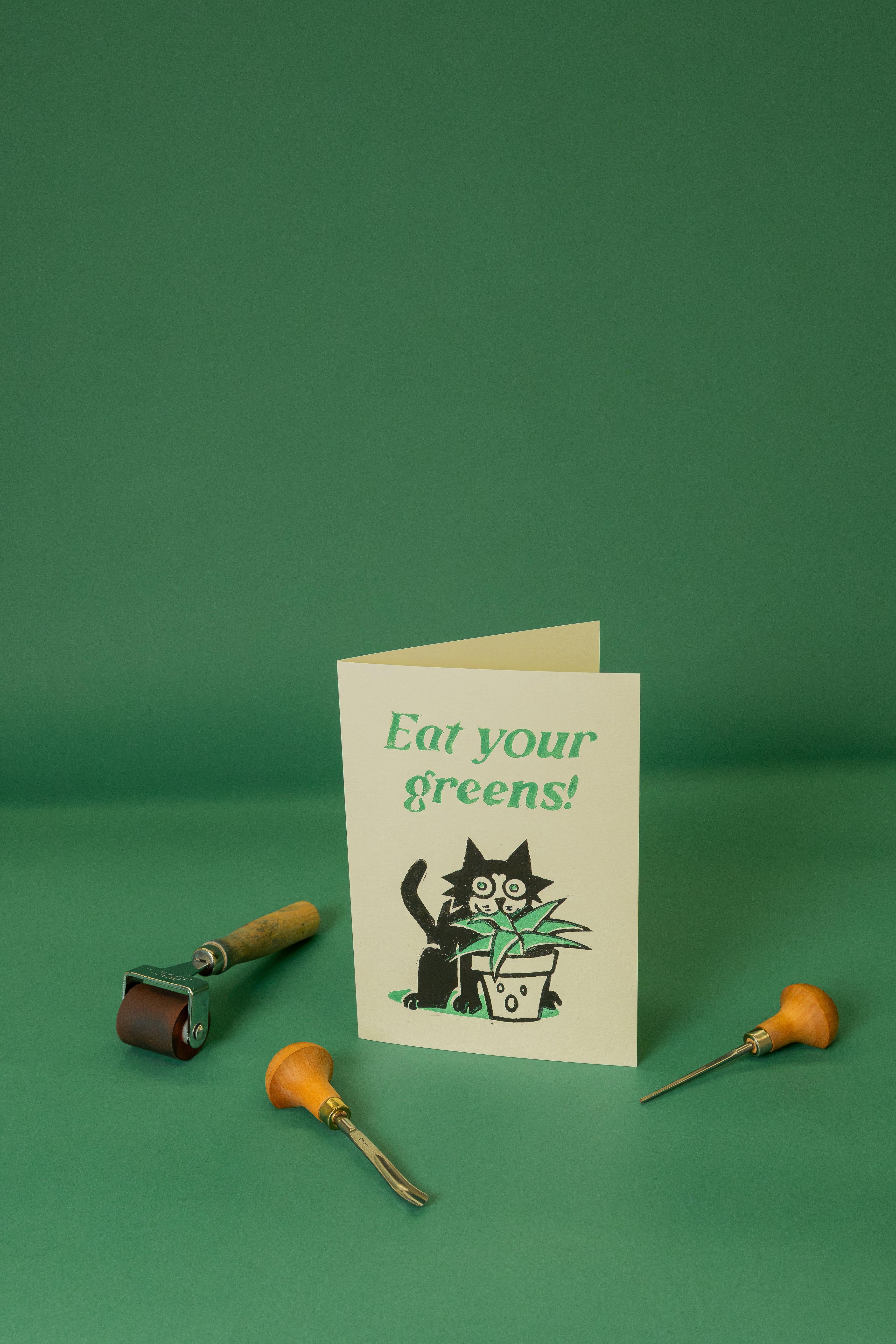 Cat eating a plant A5 card